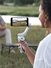 Load image into Gallery viewer, DJI OM 4 - Handheld 3-Axis Smartphone Gimbal Stabilizer with Grip, Tripod, Gimbal Stabilizer Ideal for Vlogging, YouTube, Live Video, Phone Stabilizer Compatible with iPhone and Android